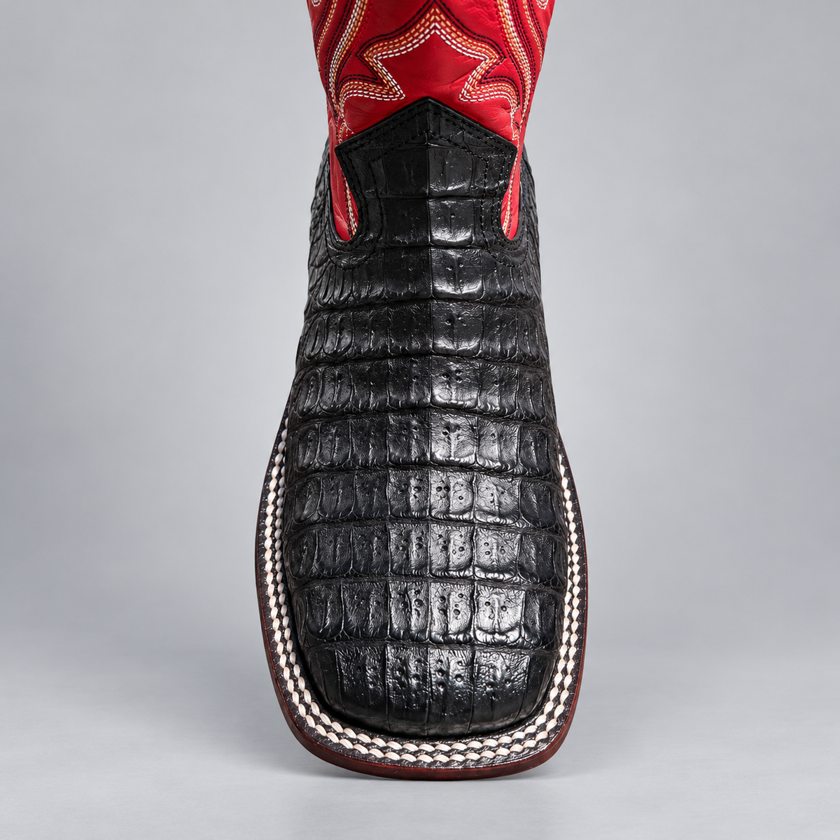 Front view of men's black crocodile square toe cowboy boot