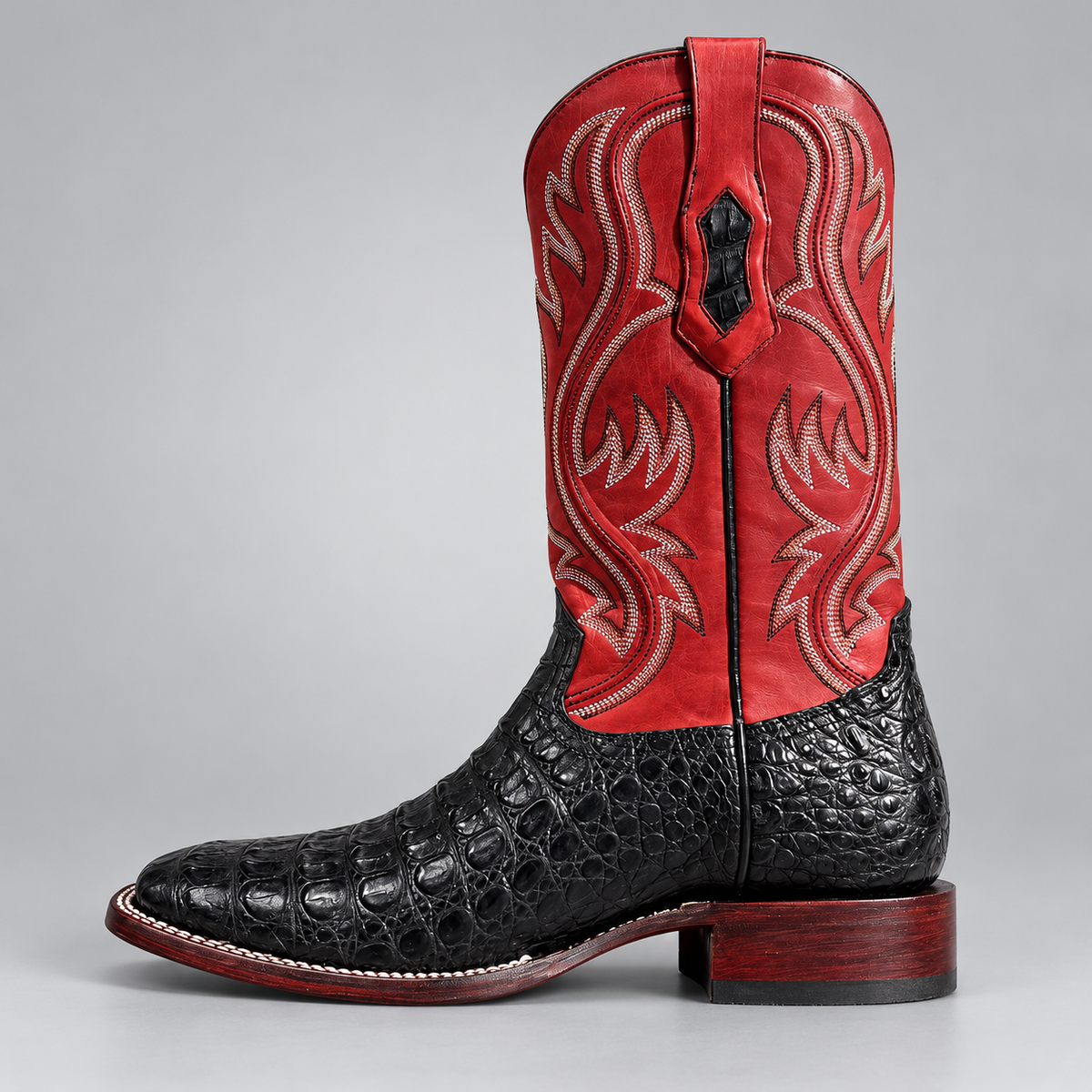 Men's black crocodile square toe cowboy boot with red flame-stitched shaft, side view
