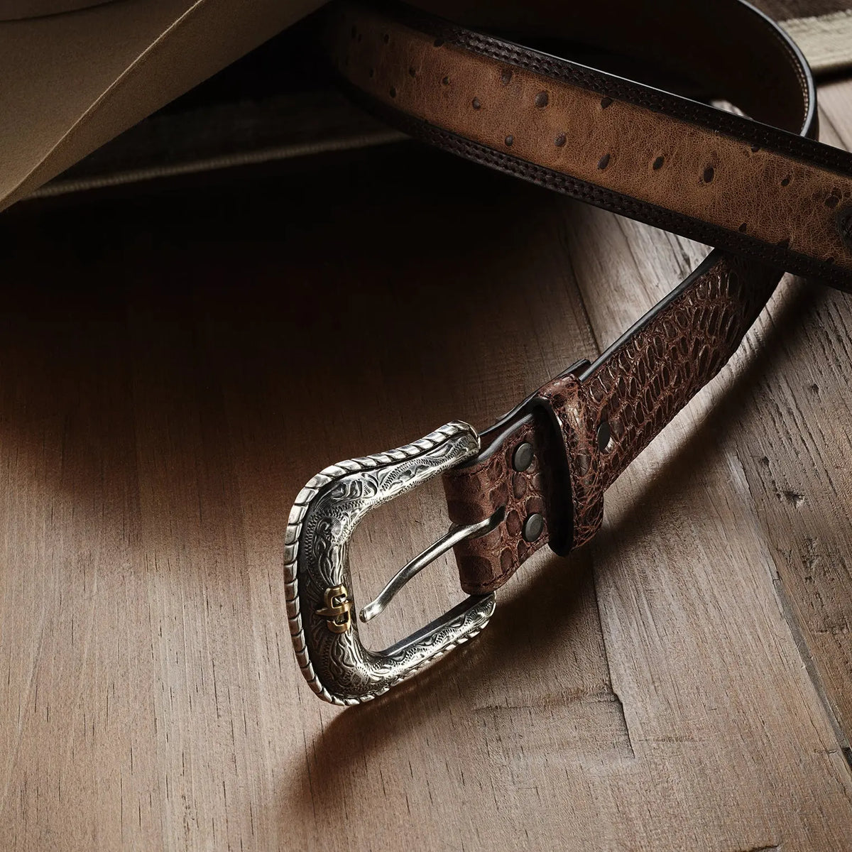 Stetson ostrich print western belt worn with jeans