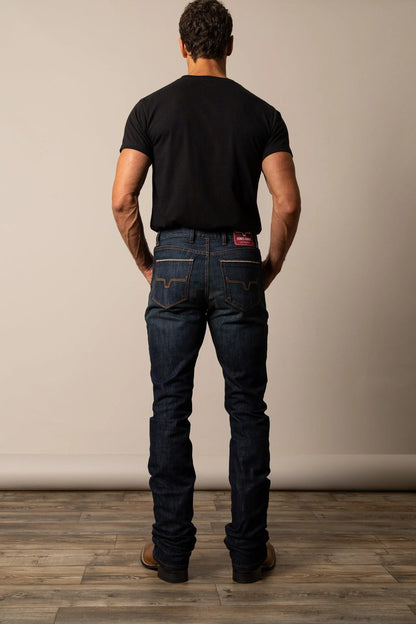 Kimes Ranch Roger Modern Bootcut jeans in blue denim, back view showing pocket stitching and red logo patch