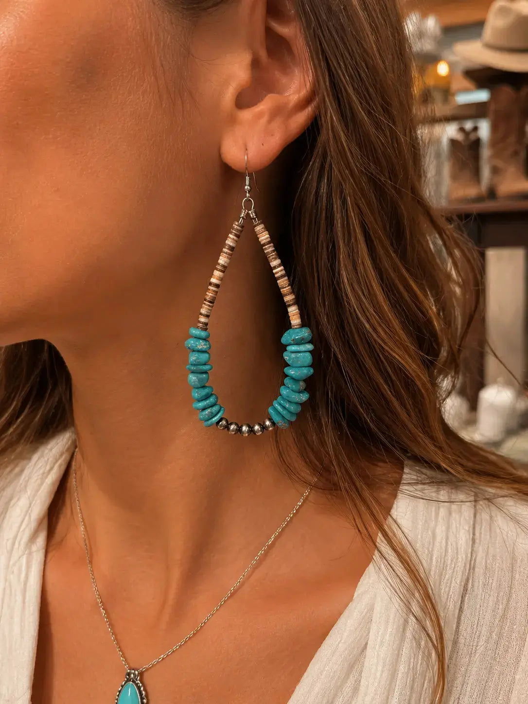 Sterling silver turquoise teardrop earrings close view